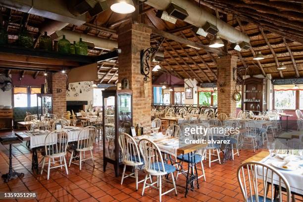 interior view of an empty restaurant - best country stock pictures, royalty-free photos & images
