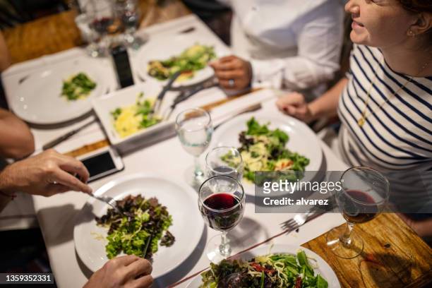 friends having lunch together at restaurant - friendship over stock pictures, royalty-free photos & images
