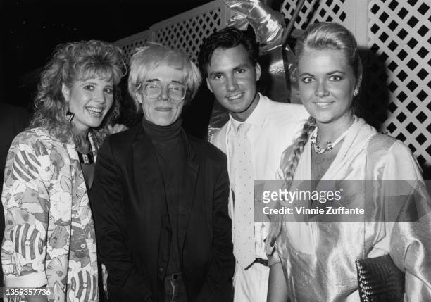 American actress Heidi Bohay, American artist Andy Warhol , American actor Phil MacGregor, and American socialite Cornelia Guest attend the premiere...