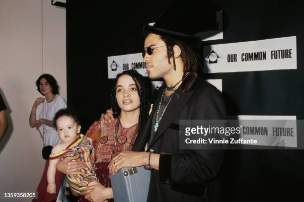 American actress Lisa Bonet , holding her daughter, Zoe Kravitz, and her husband, American singer-songwriter and musician Lenny Kravitz attend an...