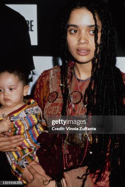 American actress Lisa Bonet , holding her daughter, Zoe Kravitz, at an 'Our Common Future' press conference at Avery Fisher Hall, part of the Lincoln...