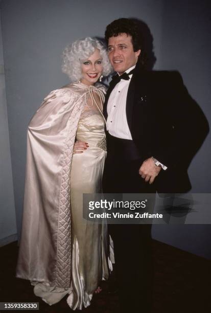 Israeli-born American actor Steve Bond, wearing a tuxedo and bow tie, and his wife, Cindy Bond wearing a champagne-coloured evening dress with a...