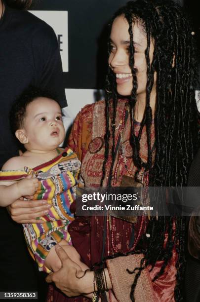 American actress Lisa Bonet , holding her daughter, Zoe Kravitz, at an 'Our Common Future' press conference at Avery Fisher Hall, part of the Lincoln...
