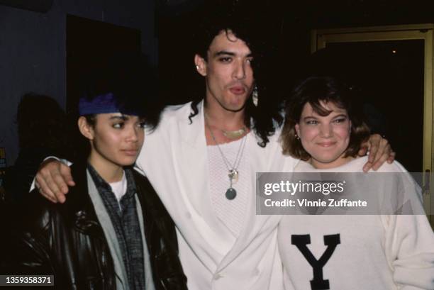 American actress Lisa Bonet , wearing a black leather jacket and a blue headband, American singer, songwriter and musician Stephen Pearcy, wearing a...