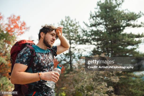 stopping for a quick breath - man sweating bildbanksfoton och bilder