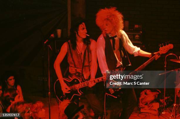 Izzy Stradlin and Duff McKagan of the rock band "Guns n' Roses" perform onstage at the Troubadour where they played "Rocket Queen" for the first time...