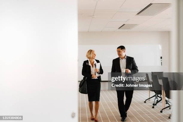 businesspeople talking in office - governing board stock pictures, royalty-free photos & images