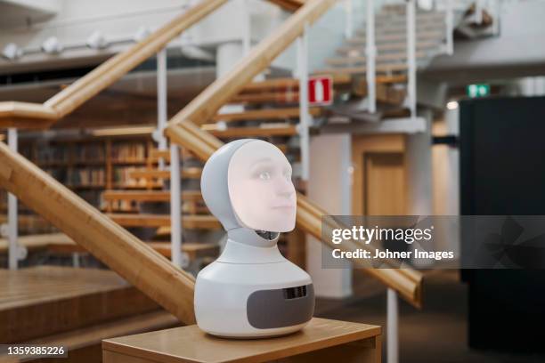 robot voice assistant in library - alexa stock pictures, royalty-free photos & images