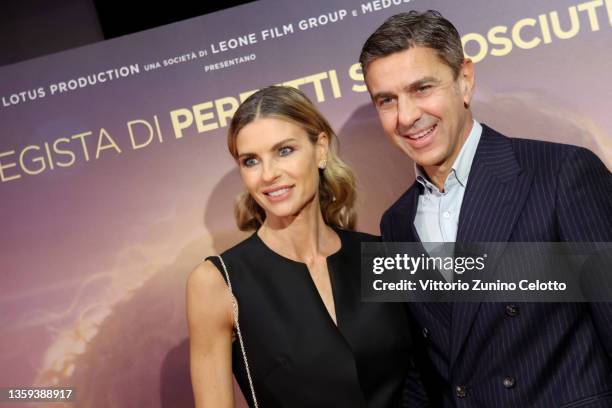 Martina Colombari and Alessandro Costacurta attend the photocall of the movie "Supereroi" at Cinema Odeon on December 16, 2021 in Milan, Italy.