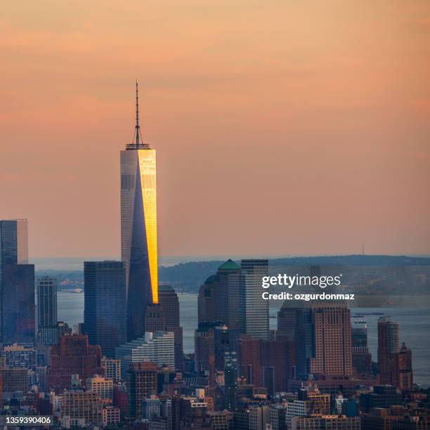 lower manhattan skyline with one world trade center at sunset, new york city, usa - home golden hour stock pictures, royalty-free photos & images