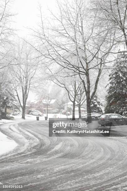 tire tracks through the snow in metro vancouver, british columbia - surrey british columbia stock pictures, royalty-free photos & images
