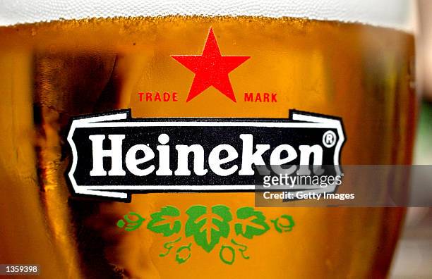Glass of Heineken beer with the brand's logo is seen in a bar August 29, 2002 in Amsterdam, Netherlands. The European Commission is investigating an...