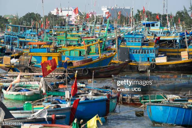 Traditional wooden fishing boats in the port city of PhanThiet, Vietnam.