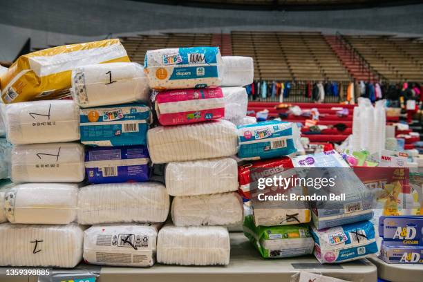 Diapers and essentials are seen at a distribution center at Mayfield high school on December 16, 2021 in Mayfield, Kentucky. Multiple tornadoes...