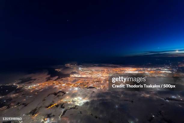 aerial view of illuminated cityscape against sky at night,dublin,ireland - dublin night sky photos et images de collection