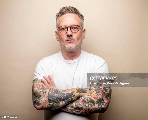 confident middle-aged man - tattoo man stock pictures, royalty-free photos & images