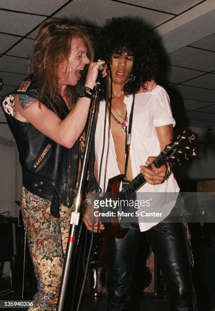Axl Rose and Slash of the rock band "Guns n' Roses" perform onstage for the second time ever with the "Appetite for Destruction" lineup at the...