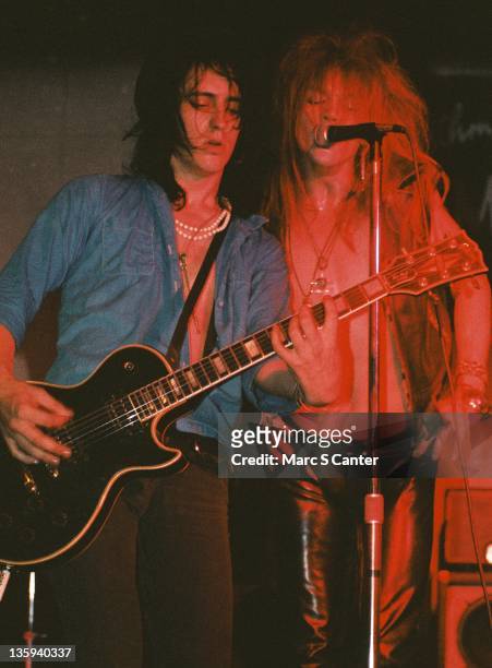 Izzy Stradlin and Axl Rose and Slash of the rock band "Guns n' Roses" perform onstage for a very small crowd at Madame Wong's East on July 4, 1985 in...