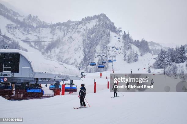 Skiers are seen on a ski slope on December 11, 2021 in Les Arcs, France. French mountain resorts reopen after a 2020 hiatus due to the Covid-19...