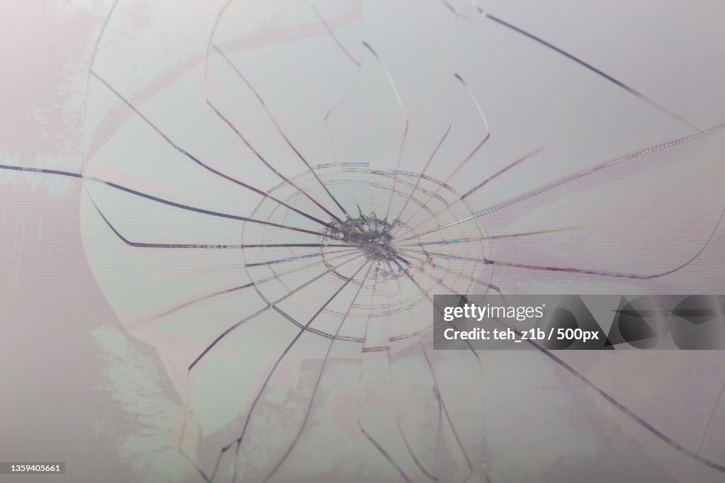 Close-up view of slanted broken lcd screen with visible pixel grid and