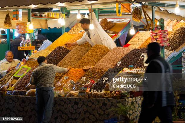 Dried nuts and fruits on a stand at djemaa El-Fna market, Marrakech, Morocco.