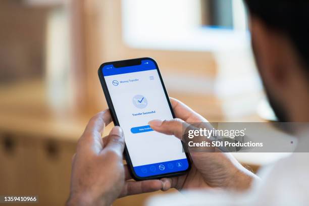 close up photo man holding phone with banking app - login stock pictures, royalty-free photos & images