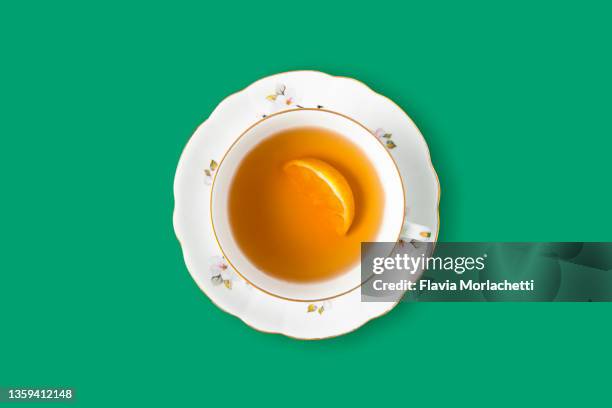 cup of tea with lemon - tea cup stock-fotos und bilder