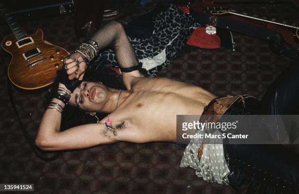 Guitarist Slash of the rock band "Guns n' Roses" backstage at the Troubadour where Tom Zutaut of Geffen Records was in the audience who later signed...