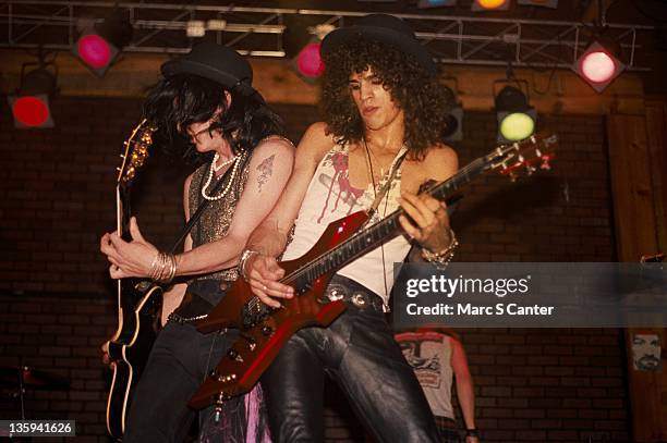 Izzy Stradlin and Slash of the rock band 'Guns n' Roses' perform onstage at the Troubadour where the "Appetite For Destruction" lineup played...