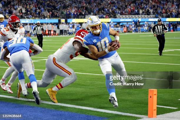 Justin Herbert of the Los Angeles Chargers runs the ball into the end zone for a touchdown in the second quarter of the game against the Kansas City...
