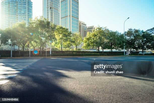 city street at sunset - zebra crossing abstract stock pictures, royalty-free photos & images