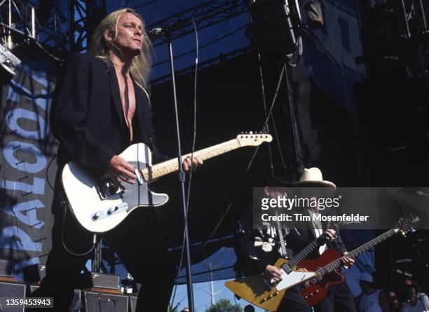 Robin Zander, Rick Nielsen, Tom Petersson of Cheap Trick perform during Lollapalooza at Winnebago County Fairgrounds on June 30, 1996 in Rockford,...