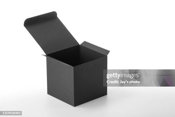craft unlabeled cardboard paper box presented on table. - black craft paper stock pictures, royalty-free photos & images