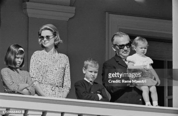 On the balcony of the Palace, Princess Grace, Prince Rainier of Monaco and their three children, Prince Albert, Princess Caroline and Princess...