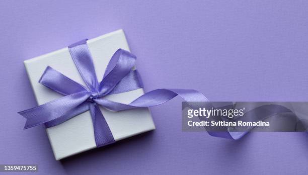 gift box. pantone color of the year 2022. very peri - white silk stock pictures, royalty-free photos & images
