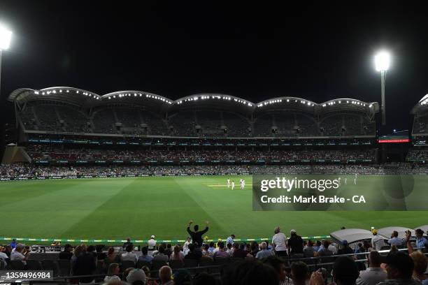 Players leave the ground after lightning during day two of the Second Test match in the Ashes series between Australia and England at Adelaide Oval...