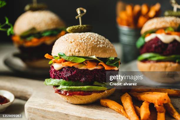 vegan food served as vegan beet burgers - burgers stock pictures, royalty-free photos & images