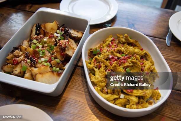 vegan roasted celeriac dish and vegan chicken schwarama dish - apio nabo fotografías e imágenes de stock