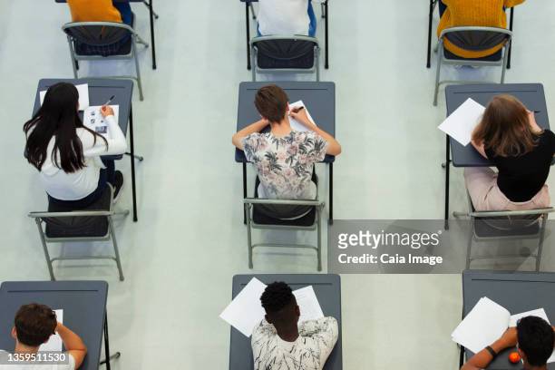 high school students taking exam at desks - ssc exam stock pictures, royalty-free photos & images