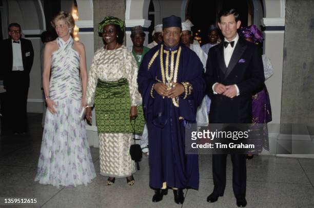 British Royal Diana, Princess of Wales , wearing a Catherine Walker evening gown, Maryam Babangida, the wife of the President of Nigeria, President...