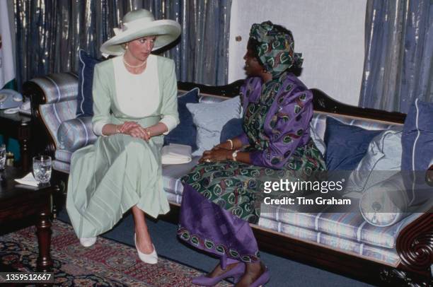 British Royal Diana, Princess of Wales , wearing a pale green-and-white Catherine Walker dress with a Philip Somerville hat, alongside Maryam...