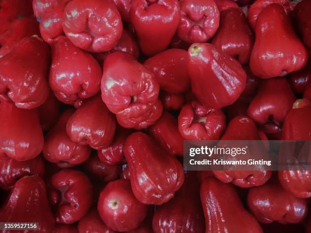 full frame of red guava fruit - water apples stock pictures, royalty-free photos & images