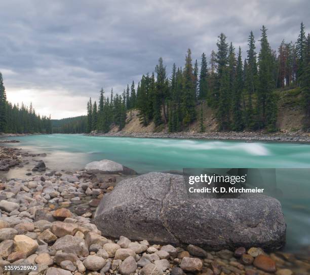 athabasca  river long exposure, jasper - riverside stock pictures, royalty-free photos & images