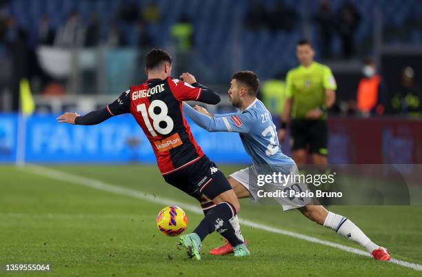 Paolo Ghiglione of Genoa and Mattia Zaccagni of Lazio battle for the ball during the Serie A match between SS Lazio and Genoa CFC at Stadio Olimpico...