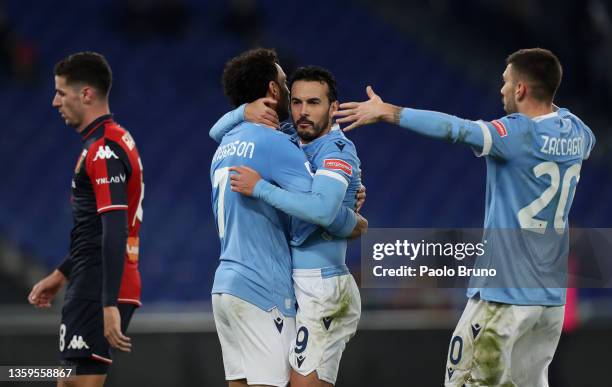 Pedro of Lazio celebrates with Felipe Anderson of Lazio and Mattia Zaccagni of Lazio after scoring his side's opening goal during the Serie A match...