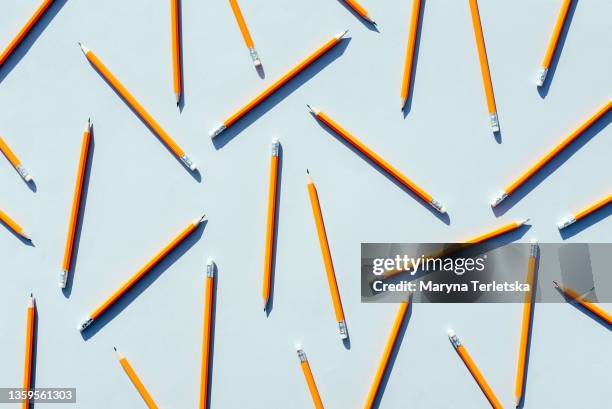 the pattern is not a colored pencil on a light blue background. - yellow pencil stock pictures, royalty-free photos & images