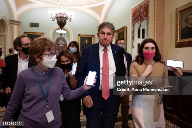 Sen. Joe Manchin is followed by reporters as he leaves a caucus meeting with Senate Democrats at the U.S. Capitol Building on December 17, 2021 in...