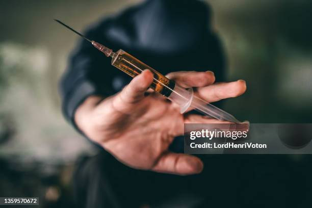 desperate drug addict with syringe - horse doping stock pictures, royalty-free photos & images