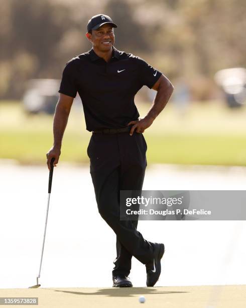 Tiger Woods looks on during the Pro-Am ahead of the PNC Championship on the Grande Lakes Orlando course at the Ritz-Carlton Golf Club on December 17,...