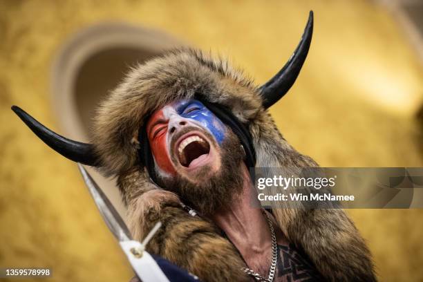 Jacob Chansley, also known as the "QAnon Shaman," screams "Freedom" inside the U.S. Senate chamber after the U.S. Capitol was breached by a mob...